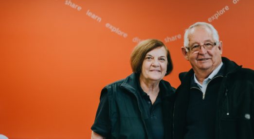 Man and woman standing together and smiling