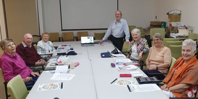 Health My Way lesson at St George Careers Development Centre featuring seniors using tablets. Session conducted by Be Connected Lead Digital Mentor George Ahern (Centre).